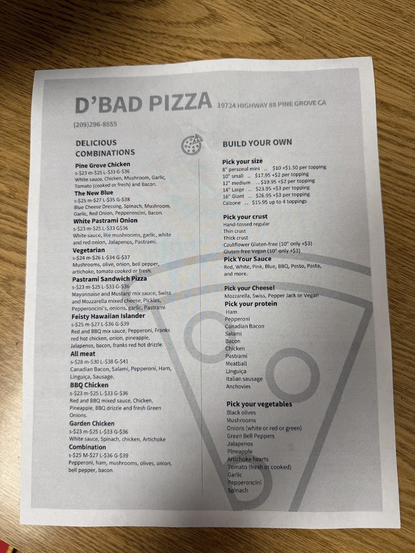 Family-friendly tables inside a large pizza restaurant.